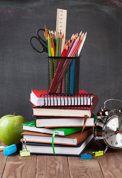 istock School and office supplies on classroom table 489564914
