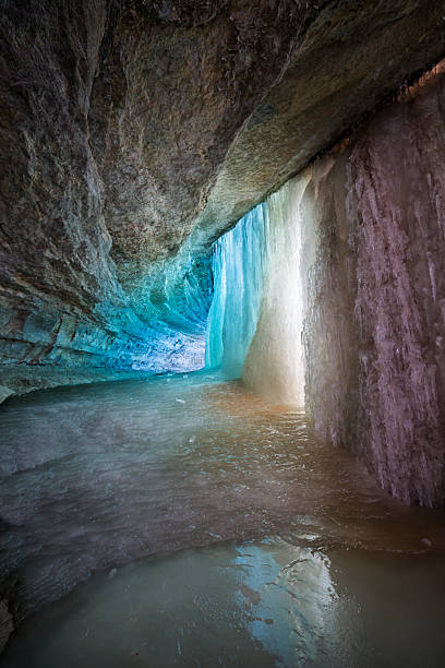 istock Turquoise tinted ice in frozen waterfall 489565150
