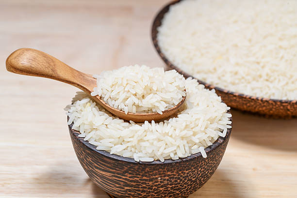 istock close-up of jasmine rice on wooden table 489565378