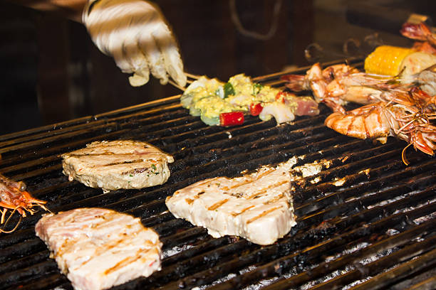 istock Chef cooking meat on the barbecue grill 489568172