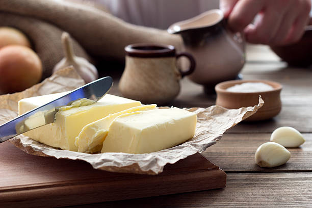 istock butter with a knife and a cup with milk 489568354