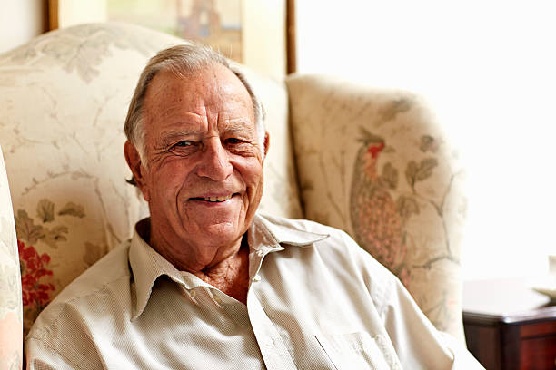 contented senior man in nursing home - 80 89 años fotografías e imágenes de stock