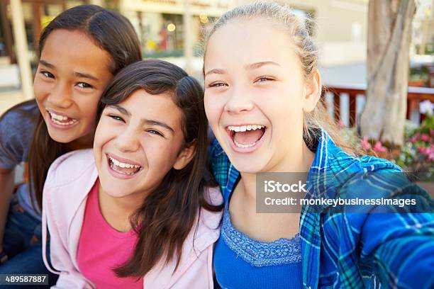 Group Of Girls Hanging Out In Mall Together Stock Photo - Download Image Now - Teenage Girls, Pre-Adolescent Child, 12-13 Years