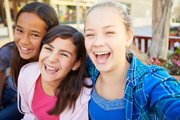 Photo of Group Of Girls Hanging Out In Mall Together