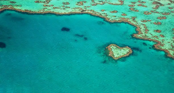 Heart-shaped reef around the Great Barrier Reef, Queensland, Australia.