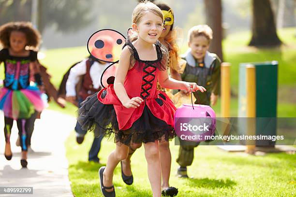 Children In Fancy Costume Dress Going Trick Or Treating Stock Photo - Download Image Now
