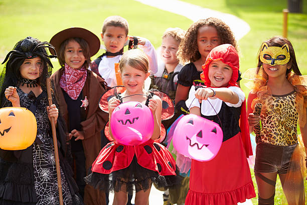 Children In Fancy Costume Dress Going Trick Or Treating Stock Photo -  Download Image Now - iStock