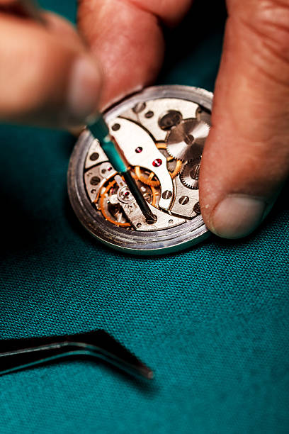 istock Repairing old pocket watch 489593325