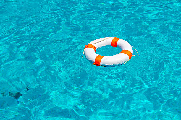 istock Life buoy in swimming pool 489599494