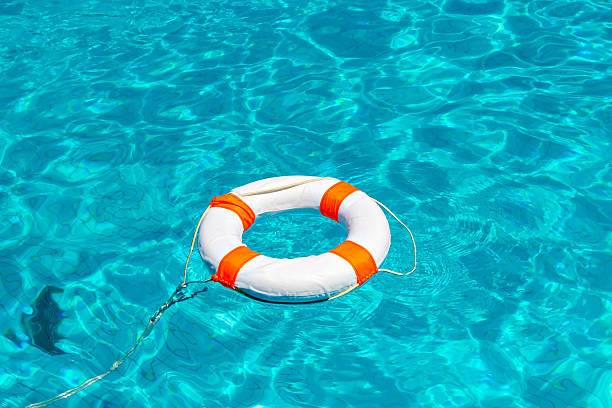 istock Life buoy in swimming pool 489599568
