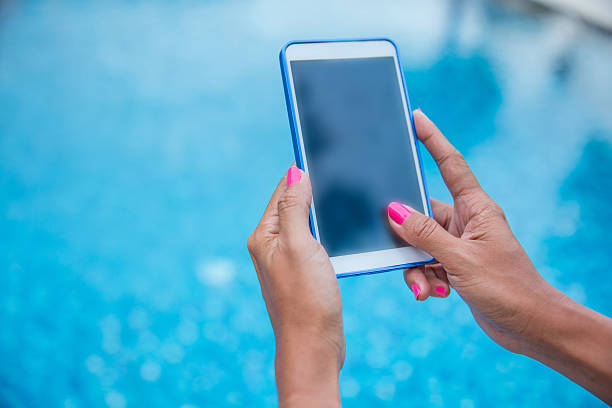 istock Close up woman hands touching smartphone screen 489600152
