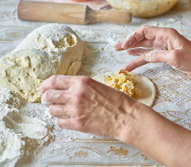 istock Kitchen, cooking pies with dough on the table 489606224