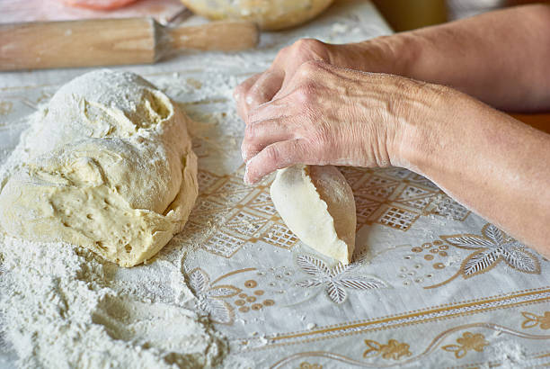 istock Kitchen, cooking pies with dough on the table 489606250
