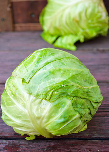 istock ripe white headed cabbage on a wooden table 489606254