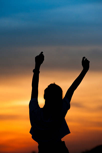 istock Happy woman and sunset silhouette 489609796