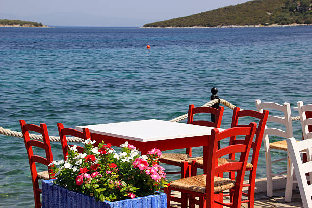 istock Greek tavern with wooden chairs 489610700