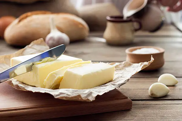 butter knife , bread , garlic and milk , breakfast in the countryside