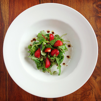 Healthy eating - gourmet salad with strawberries,