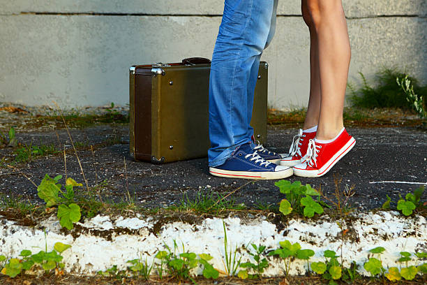 istock Young couple.Romantic meeting.Suitcase, jeans and sneakers. 489614608