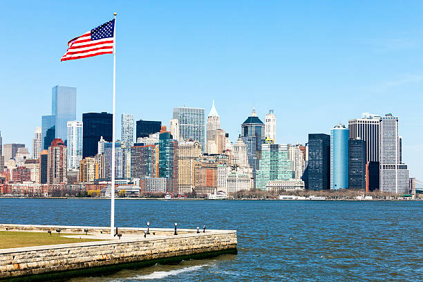istock New York Skyline with Freedom Tower and USA Flag 489614934