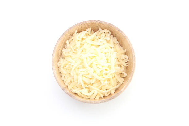 istock cheese in wood bowl isolated on white 489629068