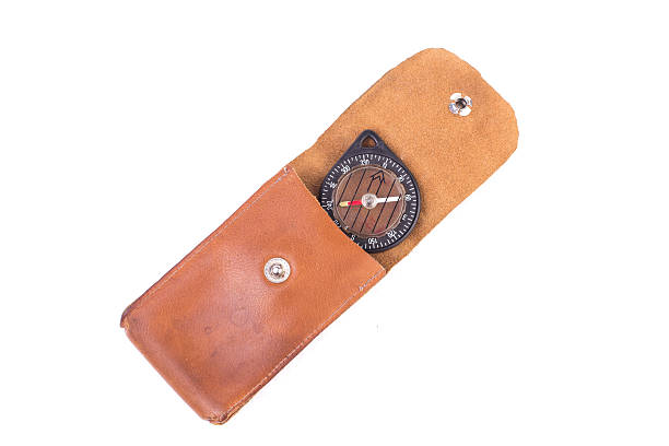 istock vintage compass in a leather case, isolated 489629934