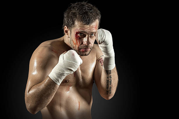 istock Portrait of aggressiv boxer in blood 489630356
