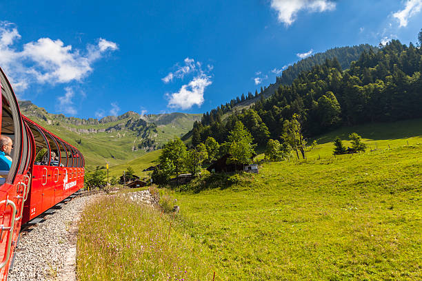 Brienz, Switzerland - June 28, 2015 : Tourists taking the steam train from Brienz to Brienzer Rothorn mountain station, on Bernese Oberland, Canton of Bern in Switzerland.
