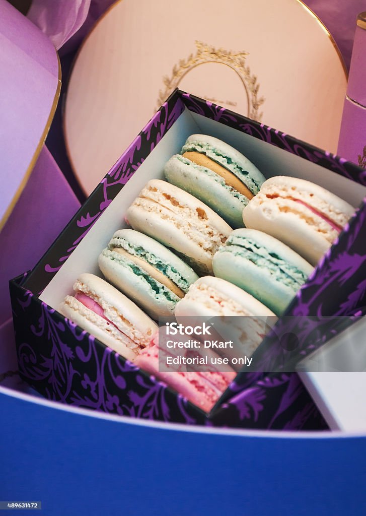 Gift set macaroons from Laduree Paris. France - September 15, 2015:  Gift set in a window Laduree pastry shop on Champs Elysees Avenue, Paris. Laduree is a luxury cakes and pastries brand based in Paris, France. It is known as the inventor of the double-decker macaron. Luxury Stock Photo