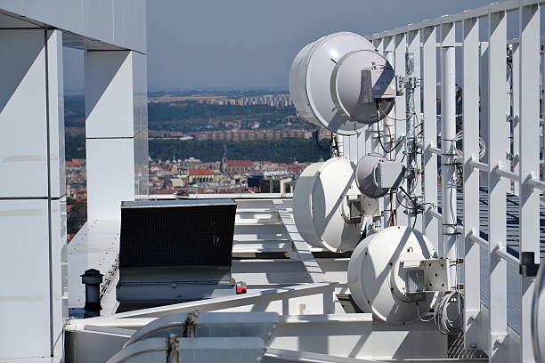 istock Bunch of transmitters and aerials on the skyscraper 489632476