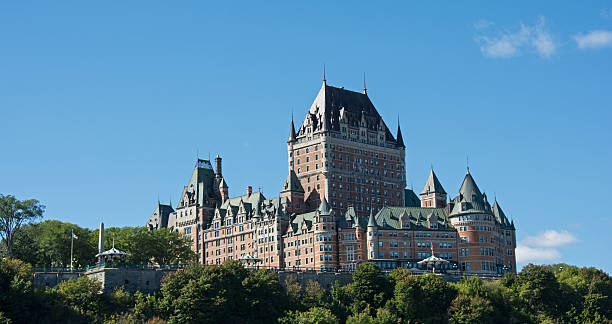 istock Fairmont Chateau Frontenac from the river with vibrant sky 489632594
