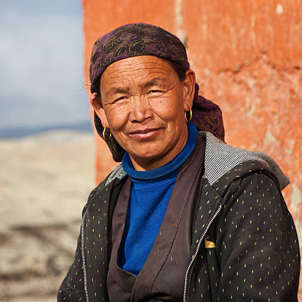 istock Tibetan woman resting in Lo Manthang, Upper Mustang 489633642