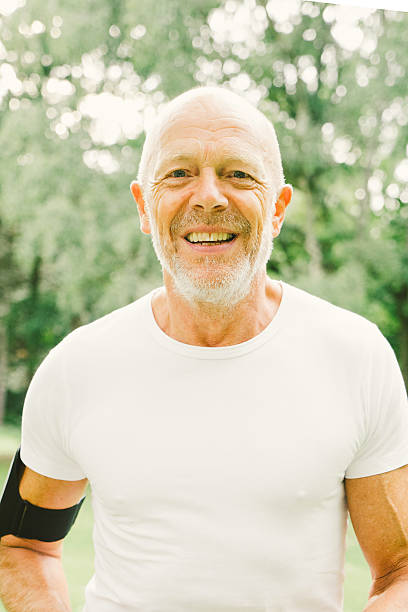 istock Senior Man Running Through The Park 489634392