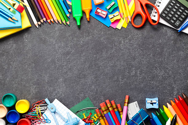 istock Chalkboard with school supplies at the bottom and top borders 489635922