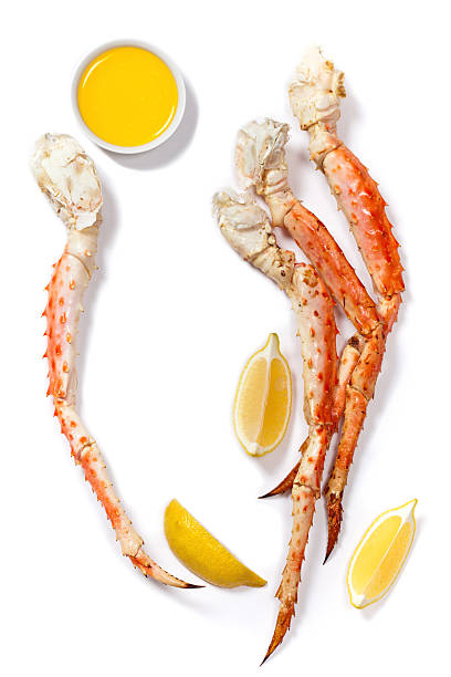 Snow Crab Legs Crab Legs on white background. Selective focus. snow crab photos stock pictures, royalty-free photos & images