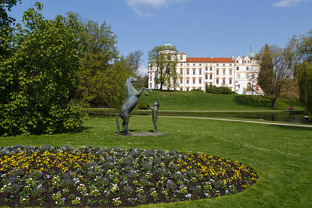 Celle, Germany - April 19, 2014: Statue in front of Celle castle illustrating a man training a horse.