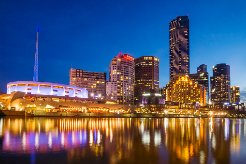Melbourne, Australia - September 5, 2015: The Southbank district of Melbourne, reflected in the Yarra River at dusk. 