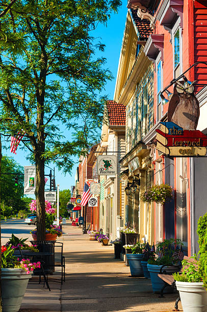 Main Street south Hudson, OH, USA - June 14, 2014: Quaint shops and businesses, anchored by the popular Learned Owl bookstore at right, go back more than a century give Hudson's Main Street a charming and inviting appeal. small town stock pictures, royalty-free photos & images