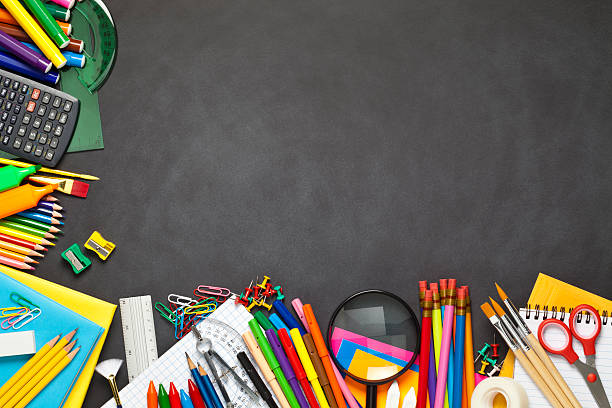 istock Chalkboard with school supplies at the left and bottom borders 489637486