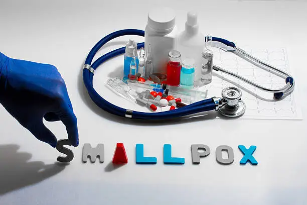 Diagnosis - Smallpox. Medical concept with pills, injection, stethoscope, cardiogram and a syringe