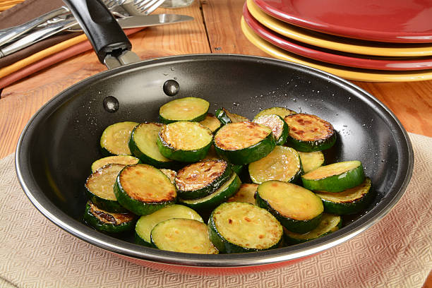 Sauteed zucchini Sauteed organic zucchine squash in a frying pan sauteed stock pictures, royalty-free photos & images