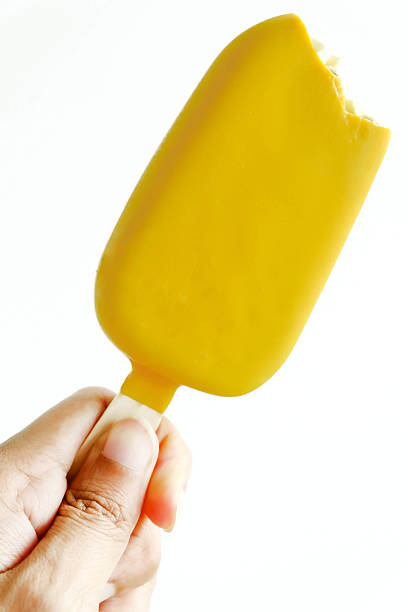 istock carry gold popsicle sticks bitten over white background 489643871