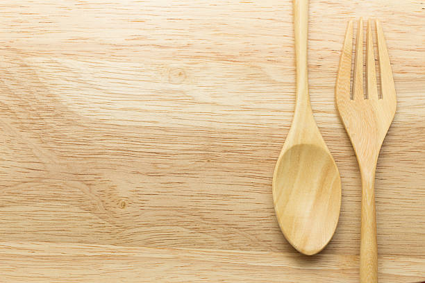 istock Wooden spoon and fork on wood background 489644220