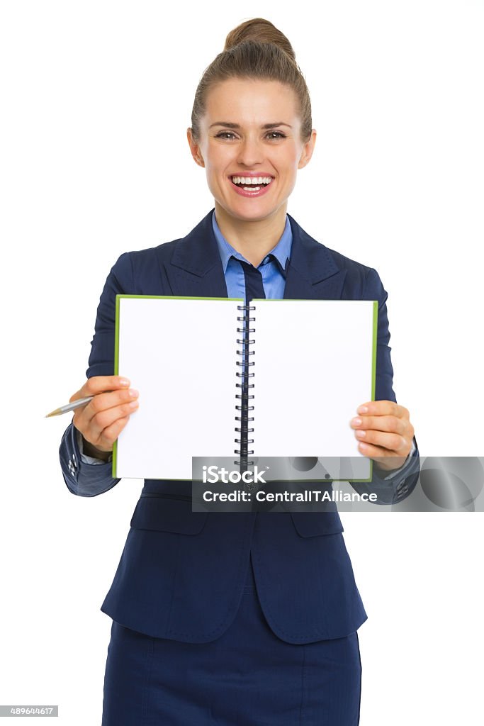 smiling business woman showing open notepad Smiling business woman showing open notepad Adult Stock Photo