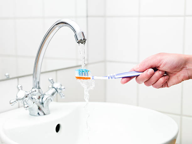 Human holding toothbrush stock photo