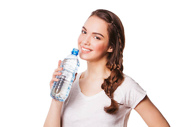 istock Beautiful girl drinking water from blue bottle 489648189