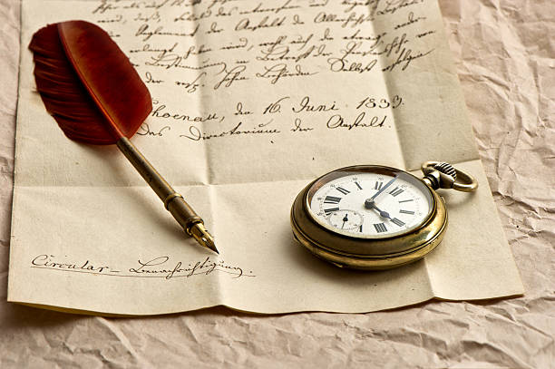 istock old letter with clock and feather quill 489648853