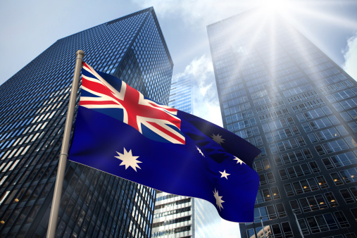 Australia national flag against low angle view of skyscrapers