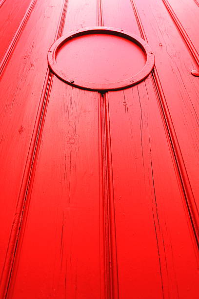 istock Red painted wooden gate with circle 489649945