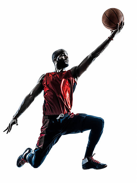 istock african man basketball player jumping silhouette 489650135